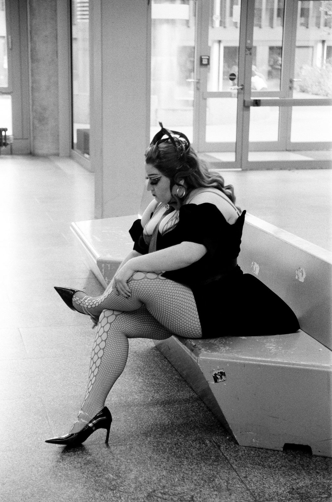 Photograph by Cheyenne Krieger — woman seated on a bench