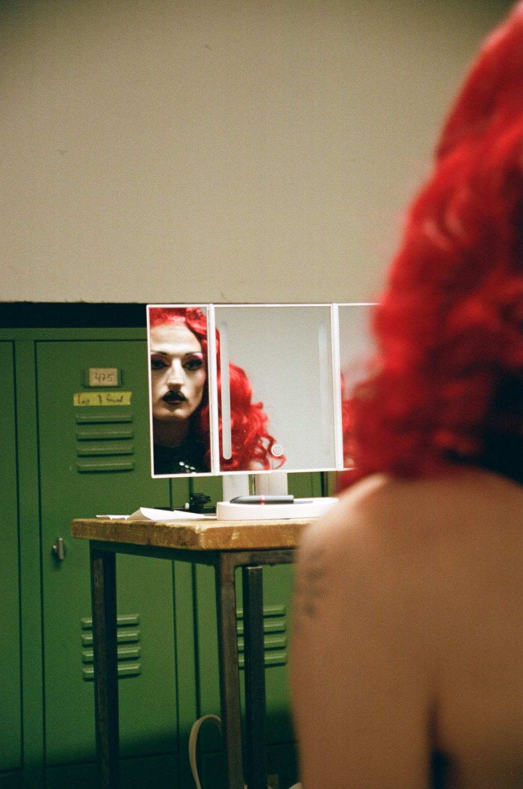 Photograph by Cheyenne Krieger — backstage mirror portrait