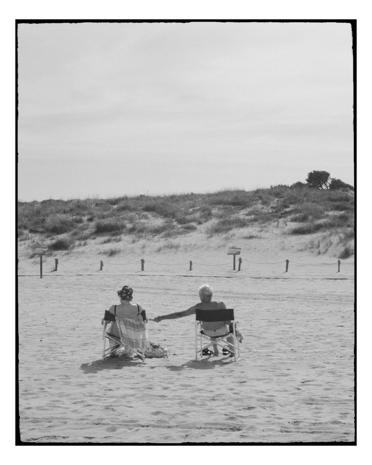 Photograph by Cheyenne Krieger — couple on the beach